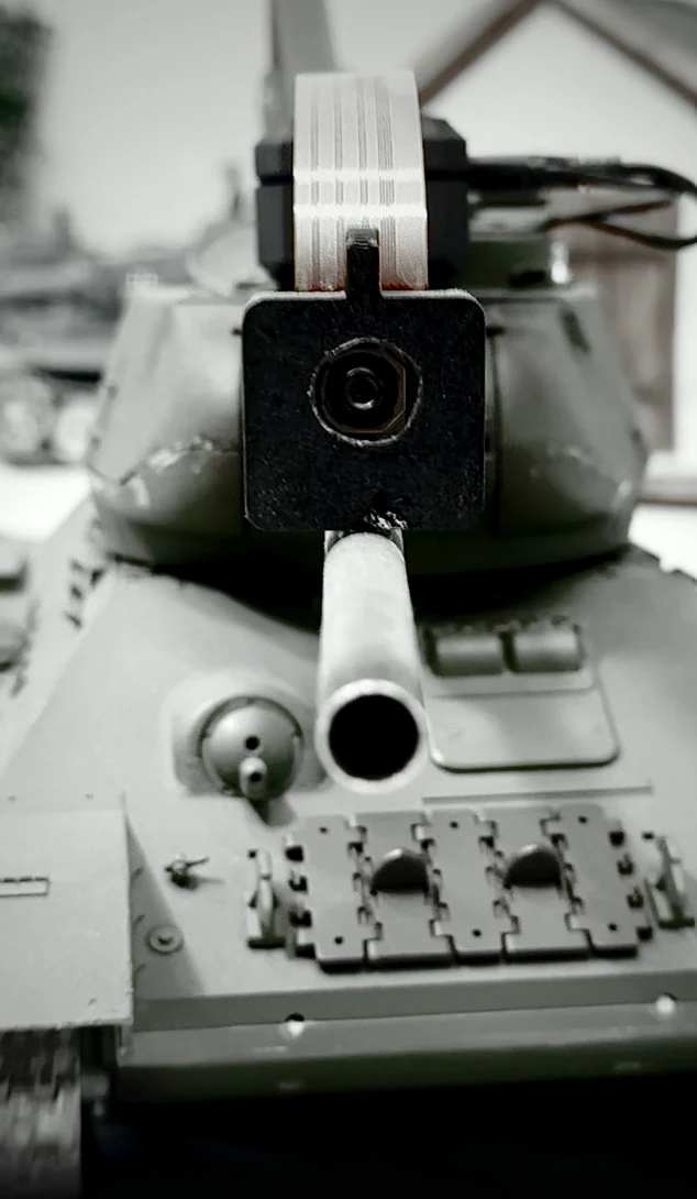 Close-up of the real onboard sight camera mounted above the tank barrel